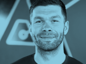 Blue-tinted headshot of Liam Conroy